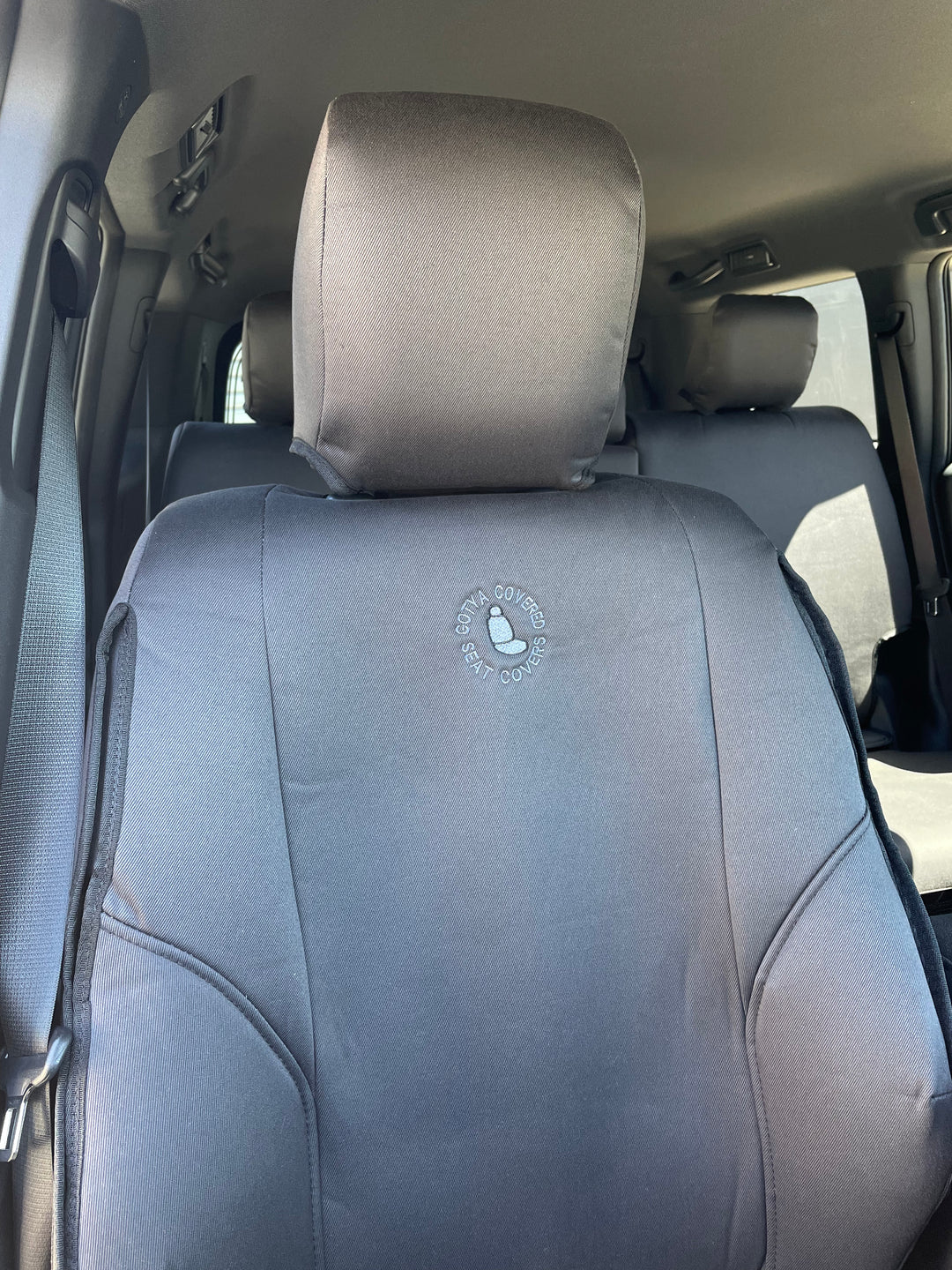 prado 250 series gxl close up of driver-denim seat cover